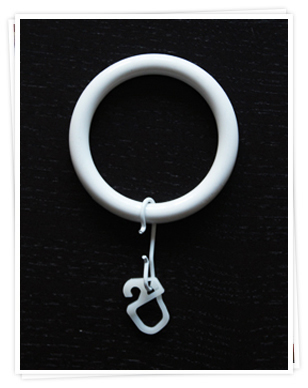 Ring with curtain hook for a curtain pole.