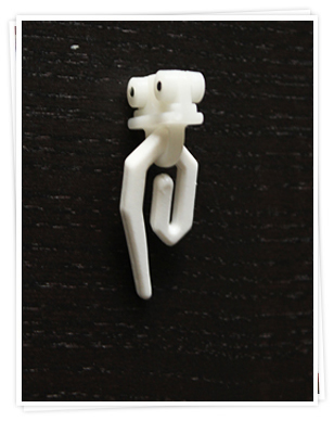 Glider with standard plastic curtain hook for a curtain track.